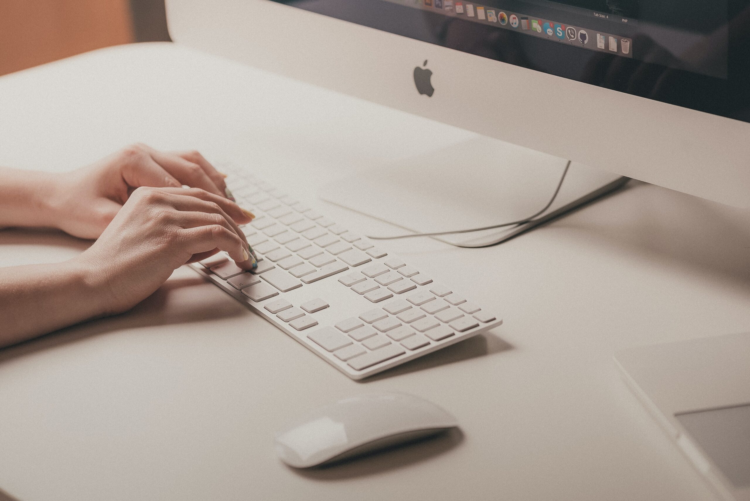 person typing on a keyboard