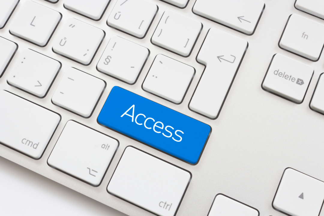 A computer keyboard with a blue key labeled Access.