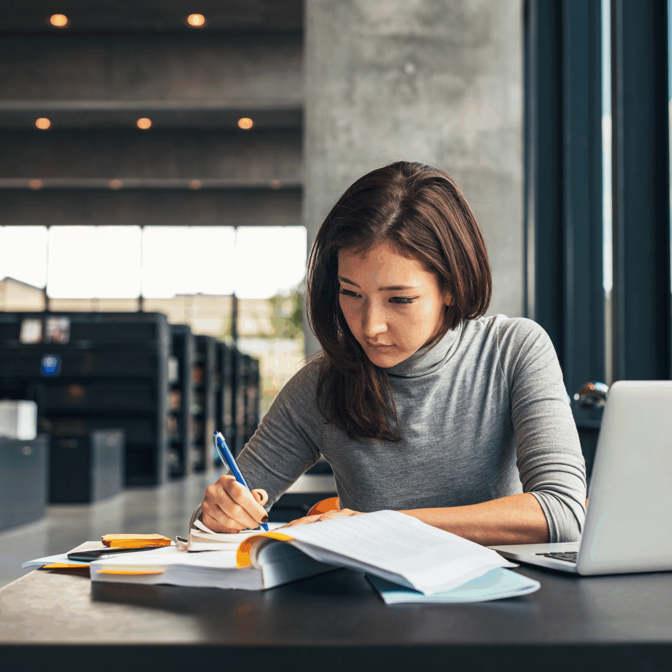 Woman writing in a notebook.